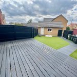 Modern garden with decking and artificial grass