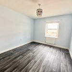 Empty room with wooden floor and window