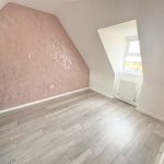 Empty room with wooden floor and window