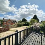 House with garden view from wooden balcony