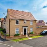 Modern suburban house with driveway and car