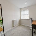 Minimalist home office with desk and shelves