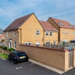 Modern UK residential homes with parked car.