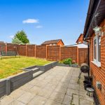 Backyard with patio, swing, and barbecue grill