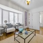 Bright living room with modern decor and seating.