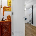 Traditional Hindu home shrine with Ganesh and decorations.