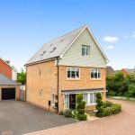 Modern detached house with driveway and garage