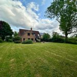 English countryside house with large garden and trees