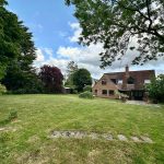 Brick house with large green garden