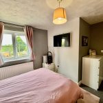 Cosy bedroom with double bed and TV