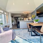 Modern open-plan living area with stylish decor.