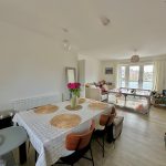 Cosy living room and dining area with plants.