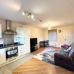 Modern open-plan kitchen and living room.