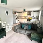 Modern open-plan living room with kitchen