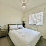 Modern bedroom with double bed and bedside table