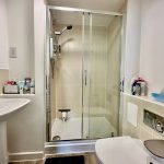 Modern bathroom with shower and toiletries