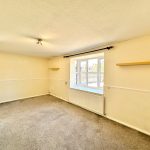 Empty room with window and shelves