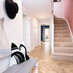Modern hallway with stairs and patterned walls