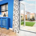 Blue room with open patio doors to garden.