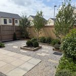 Modern garden with paving and trees.