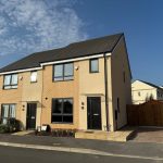 Modern semi-detached house on sunny day