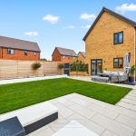 Modern garden with patio and grass lawn