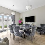 Luxurious dining room with elegant grey furniture.