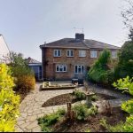 Brick house with garden and patio view