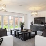 Modern living room with garden view and decor.