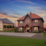 Brick house with garden at sunset