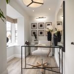 Stylish modern home office with art and desk