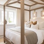 Bright bedroom with large wooden bed frame
