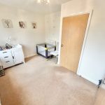 Nursery room with cot and changing table