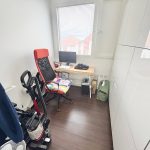 Small study room with desk and chair.