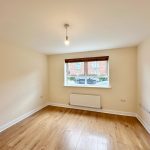 Empty room with wooden floor and window