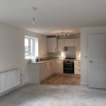 Modern kitchen with beige cabinets and oven