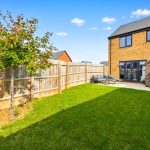 Modern garden with patio area and tree