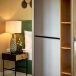 Modern bedroom with lamp and wooden nightstand