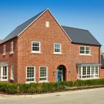 New brick house with landscaped front garden.