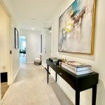 Bright hallway with modern art and console table