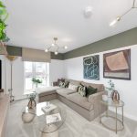 Modern living room with beige sofa and artwork.