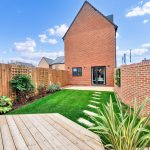 Modern house with garden and patio area.