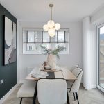 Modern dining room with abstract art and lighting.