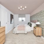 Modern bedroom with patterned wallpaper and cosy bed