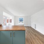 Spacious open-plan kitchen and living room interior.