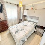 Modern bedroom with double bed and dresser