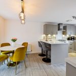 Modern kitchen with dining area and pendant light
