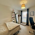 Cosy bedroom with desk and window light