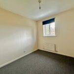 Empty room with window and radiator