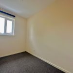Empty room with carpet and window view